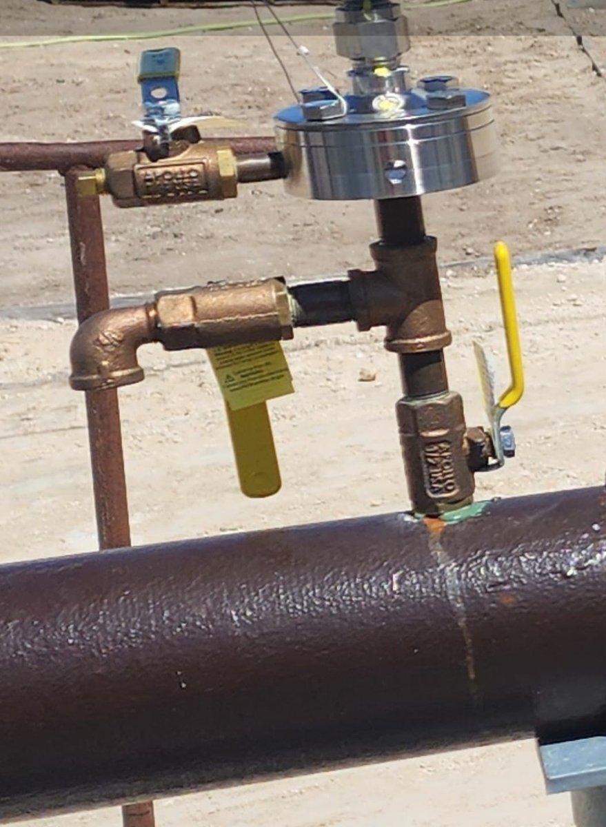 Manual air vents connected to suction and discharge pressure gauges.